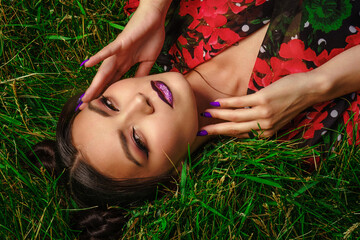 woman laying on grass
