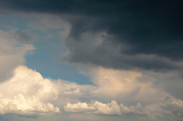 Blue sky background with tiny clouds