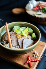Noodles beef on wooden board , Thailand food - Asian food style
