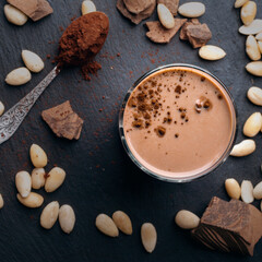Fototapeta na wymiar Almond milk with cocoa ingredients and honey for a healthy breakfast.