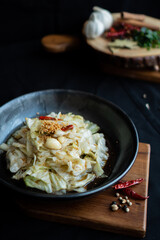 Stir-Fried Cabbage with Fish Sauce on wooden board - Asian food style