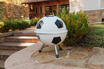 Metal brazier in form of a soccer ball