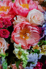 beautiful and vibrant bouquets of flowers in a vase, pink bouquets to decorate a wedding or holiday, florists decorate the event or wedding, a bouquet of pink peonies on the table, flowers as a gift