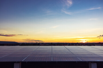 solar cells panel installed on the roof of a large building are full of dirt and dust. grouping of photovoltaic solar panels on rooftop.
