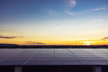 solar cells panel installed on the roof of a large building are full of dirt and dust. grouping of...