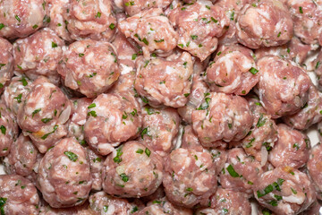 Raw pork meat balls, macro shot texture.