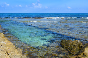 Hof Dor - Beach Nature Reserve, picturesque beach, a coastal strip with more bays and inlets and ruins of the ancient port are visible under the water, northern Israel