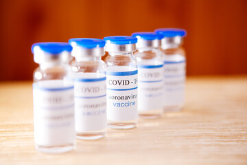 Vaccination ampoules as a pyramid, coronavirus pandemic concept