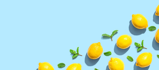 Fresh yellow lemons with mints overhead view