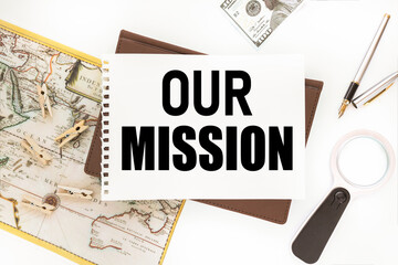 Our Mission. Text on white paper that lies on the diary