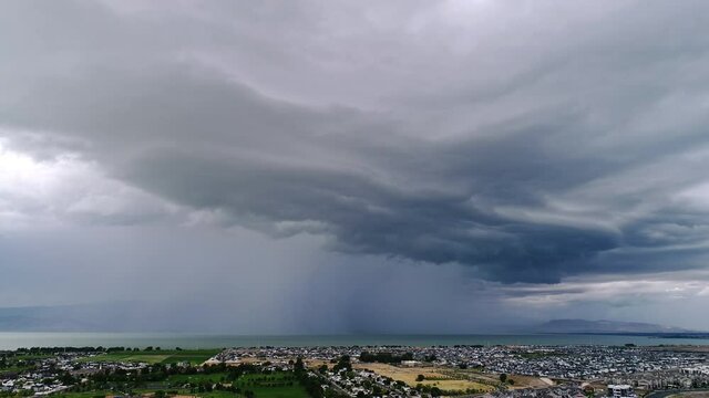 Aerial view of wall cloud moving over Utah Lake as storm follows from aerial view.