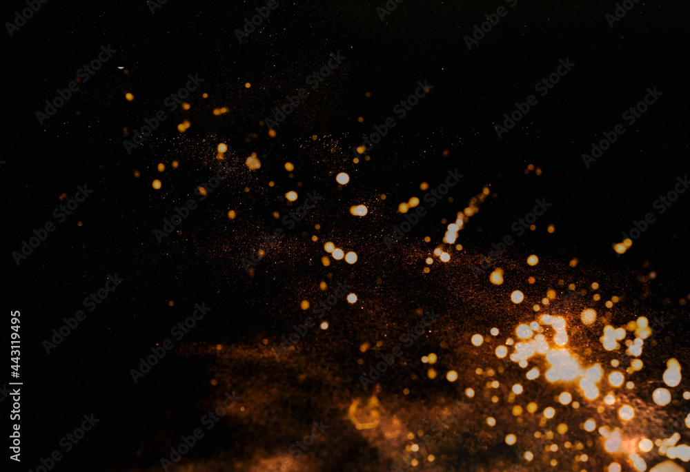 Poster abstract dark background with gold sparkles . festive background for design. blurred effect. creativ
