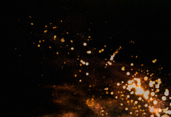 Abstract dark background with gold sparkles . Festive background for design. Blurred effect. Creative copy space