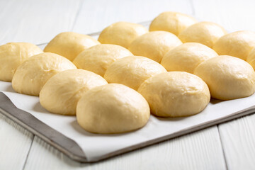 Sweet yeast buns before baking.