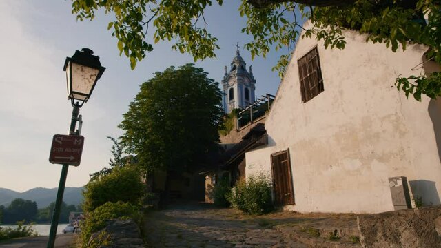 View of D&uuml;rnstein at the river Danube at Spring sunset, Wachau, Austria. Side view of D&uuml;rnstein Abbey. Former monastery in Wachau, Lower Austria.