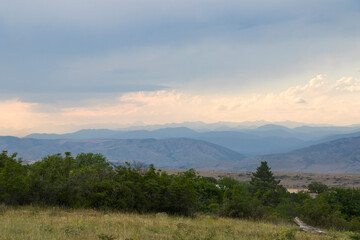 Mountain landscape in Georgia, clouds and blue sky. Mountain range.