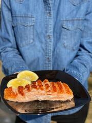 Grilled salmon fillet on a plate.