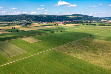 Fototapeta na wymiar The landscape of the Werra Valley with the Werra River and agriculture fields at Herleshausen in Hesse and Thuringia