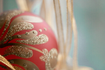 Red Christmas baubles decoration on red background with copy space. New Year card. Minimal style.