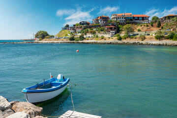 old town of nessebar, bulgaria. fishing boat moored on the coast. sunny weather. popular travel destination