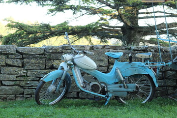 the old, blue motorcycle 