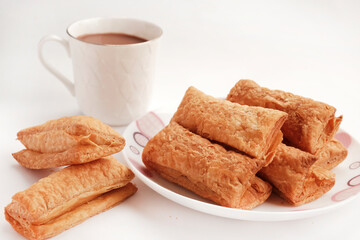 Indian khari or kharee or salty Puffy brown Snacks, served with indian hot tea, Indian Breakfast, Copy Space