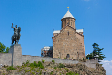 Tbilisi, Georgia - August 7,2013: Virgin Mary Metekhi church with Vakhtang I Gorgasali statue in Tbilisi, Georgia - 443131428