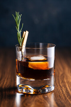 Glass of whiskey with rosemary