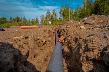 sewer pipe laid in a trench, preparation for the construction of the foundation