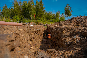 building a house, initial stages to the foundation, laying sewer pipesм
