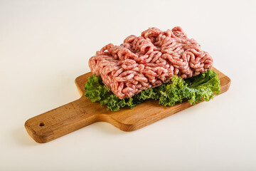 Raw pork minced meat over board