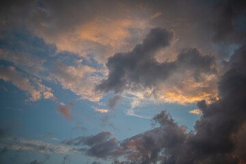 Fototapeta na wymiar a dark thundercloud on the background of sunset
