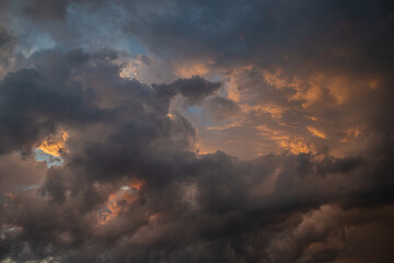 Obraz premium a dark thundercloud on the background of sunset