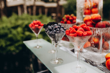 setting the wedding table with fruit in the garden