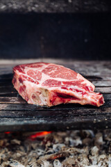 Dry aged rib eye steak on a charcoal grill