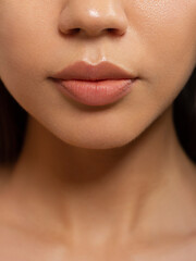 Sexual full lips. Natural gloss of lips and woman's skin. The mouth is closed. Increase in lips,...