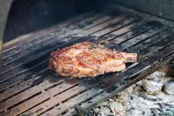 Dry aged rib eye steak on a charcoal grill