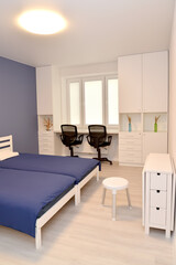 Naklejka na ściany i meble Fragment of bedroom interior with white furniture
