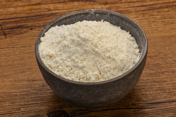 Wheat flour heap in the bowl