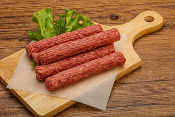Raw beef sausages with spices