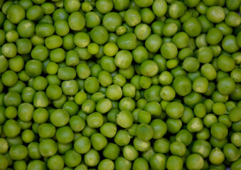 abstract background of grains of peeled green peas, grains of a round shape and different sizes