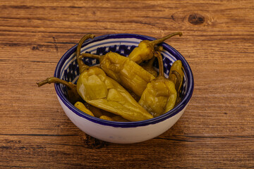 Marinated spicy and hot green pepper
