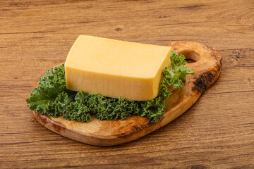 Tasty yelloow Tilsiter cheese brick