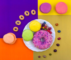 delicious sweet donuts and bright candies
