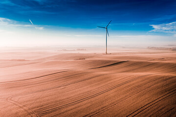 Wind turbine on field. Alternative energy in Poland.
