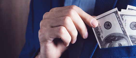 man counts money calculating finance