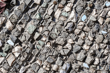 An Old Artistic Grunge Texture. Background of Wall of granite multicolored stones and concrete