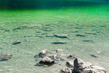 Faboulus landscape of Eibsee Lake with turquoise water in front of Zugspitze summit under sunlight. Location: Eibsee lake, Garmisch-Partenkirchen Bavarian alps, Germany, Europe