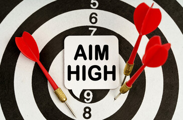 There is a sign on the target that says - AIM HIGH