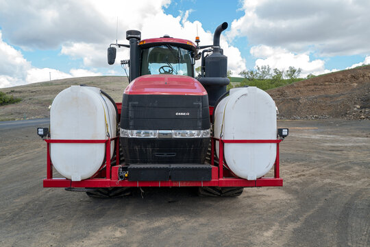Front of a Case IH Steiger JTI 620 Quadtrac tractor in a parking lot near Wilcox, Washington, USA - May 4, 2021